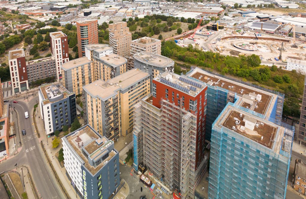 An aerial view of a city with tall buildings.