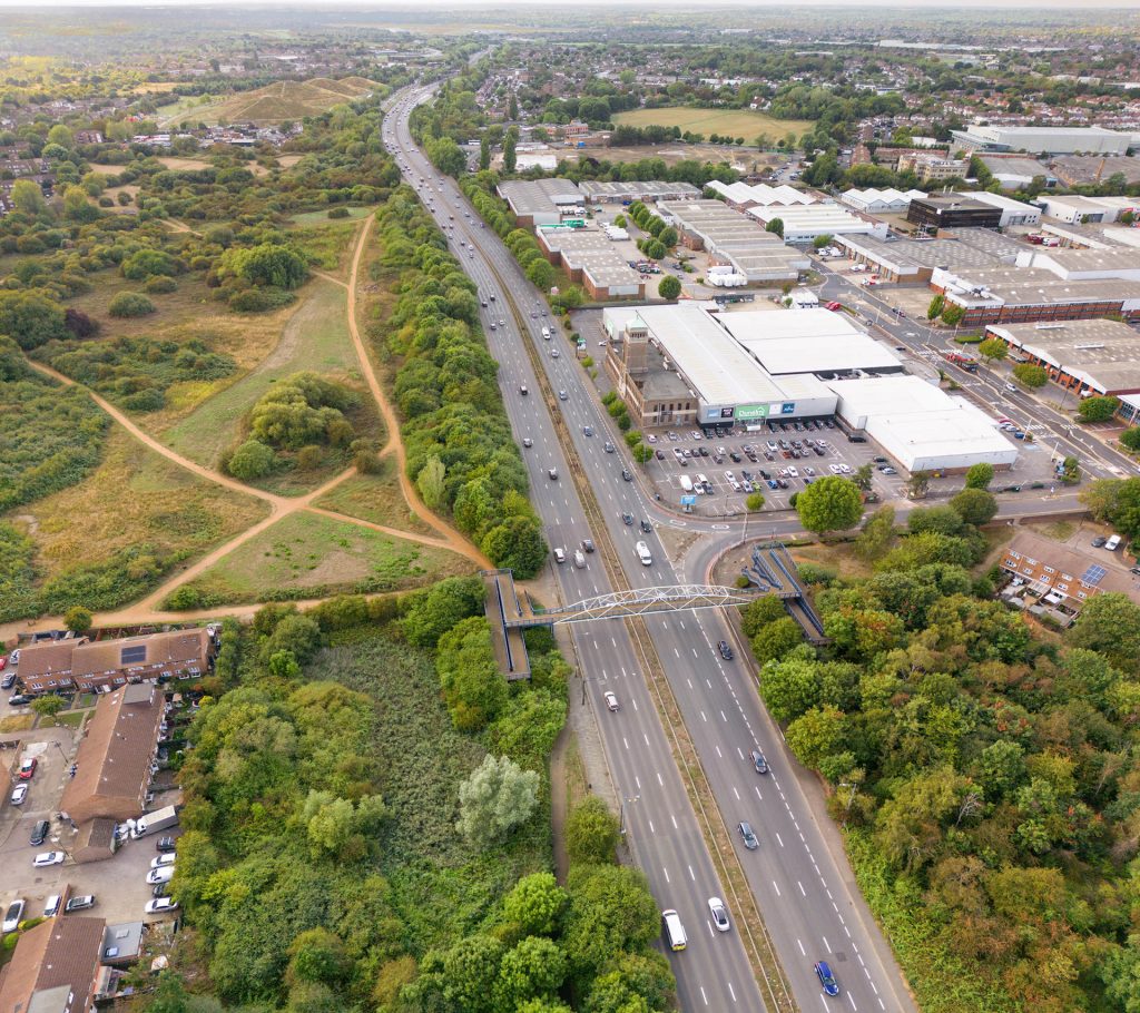 An aerial view of a highway with cars on it.